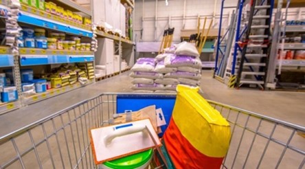 A shopping cart full of bags and other itemsAI-generated content may be incorrect.